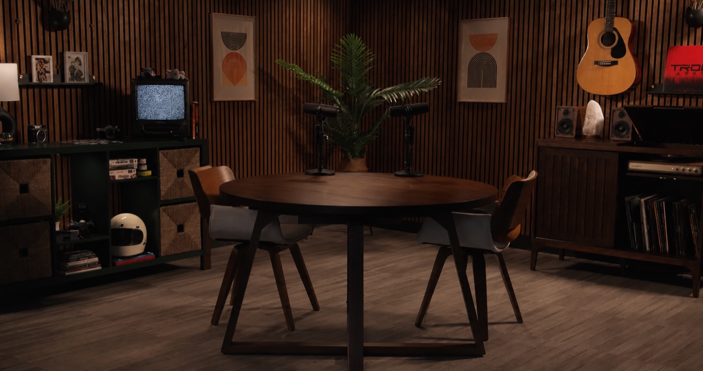 A MarketScale studio set with a podcast table and microphones