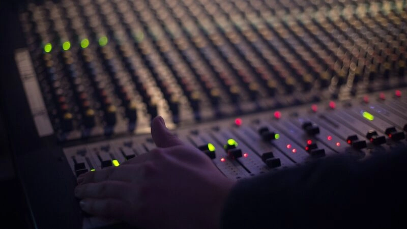 Volunteer Operating an Audio Console