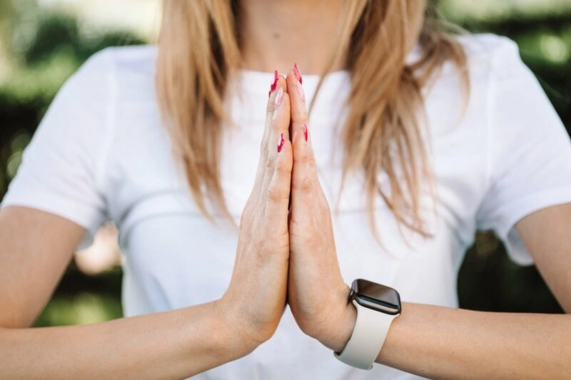 Woman with Apple Watch Practices Yoga